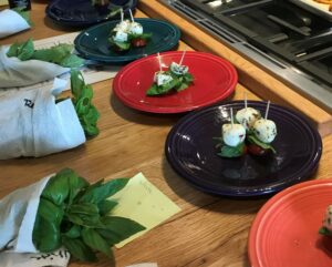plates with basil, mozzarella and tomato